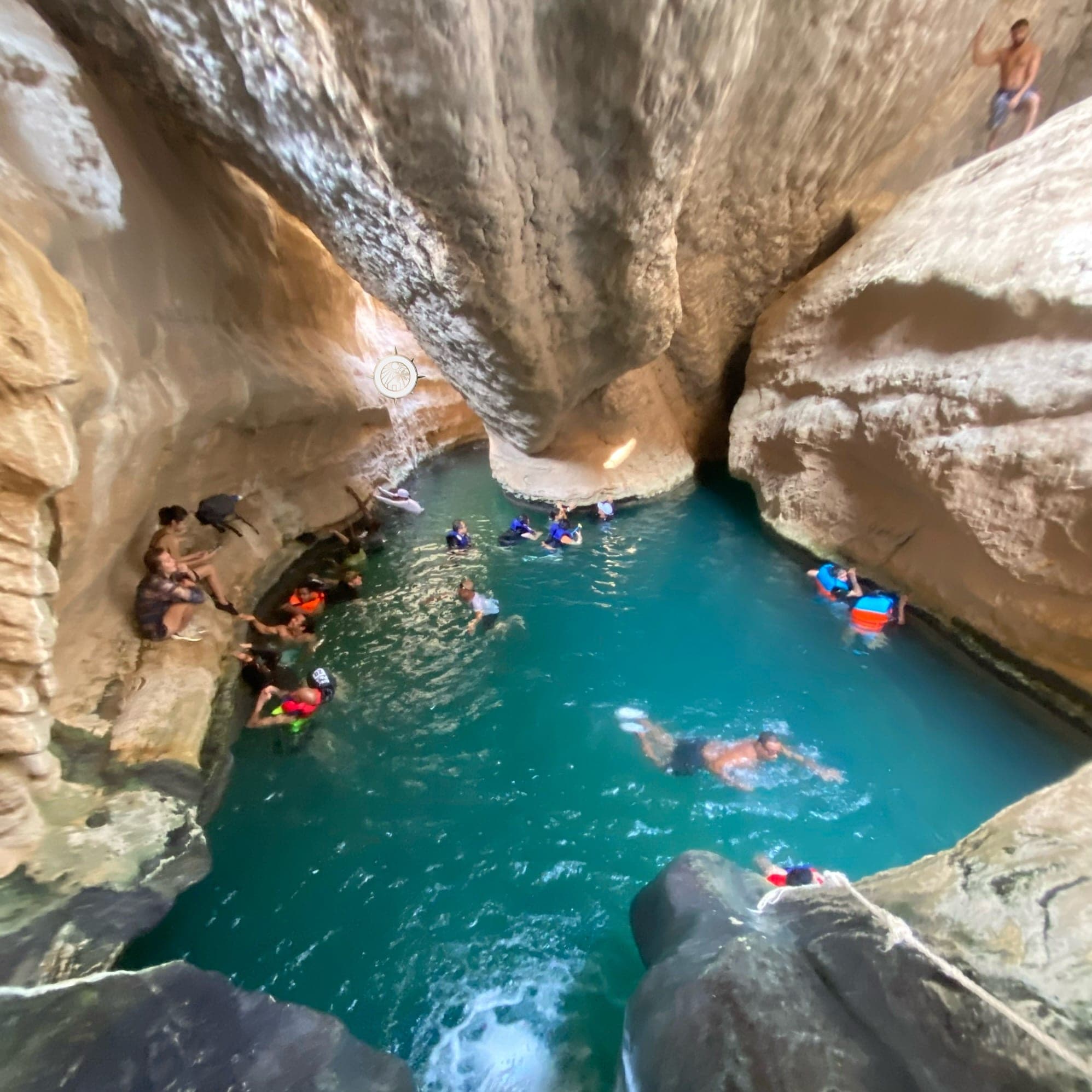 Swimming in the hidden waterfall cave at Wadi Shab