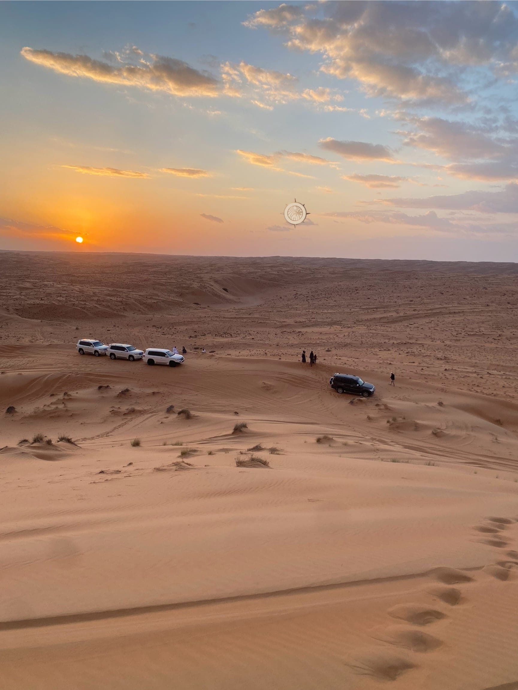 Sunset convoy on the dunes of the Wahiba Sands